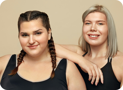 two woman standing next to each other